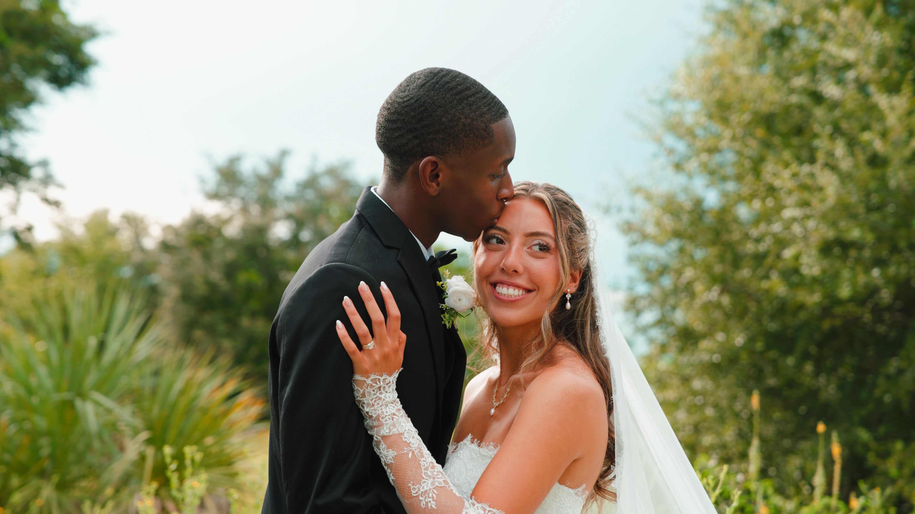 Wedding couple embracing outdoors